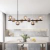 31e25249-0434-4666-8227-787debe3ba45.jpg A Long Minimalist Glass Magic Bean Chandelier