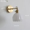 5baf58e0-b726-432c-9479-3dc87eba1dda_trans.jpeg Retro Copper Glass Amber Little Flower Single-head Bedroom Simple Chandelier