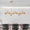 60f45aca-fab3-4f95-86c3-cf7b6cd6b6fb.jpg A Long Minimalist Glass Magic Bean Chandelier