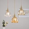 ed67aa8c-89fb-46f7-b230-ff06fad32abb_trans.jpeg Retro Copper Glass Amber Little Flower Single-head Bedroom Simple Chandelier