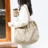 7085117e-ad45-4567-a5dd-194fc51960e0.jpg Ins Corduroy Shoulder Bags Drawstring Multi-pocket Handbag Women Underarm Bags